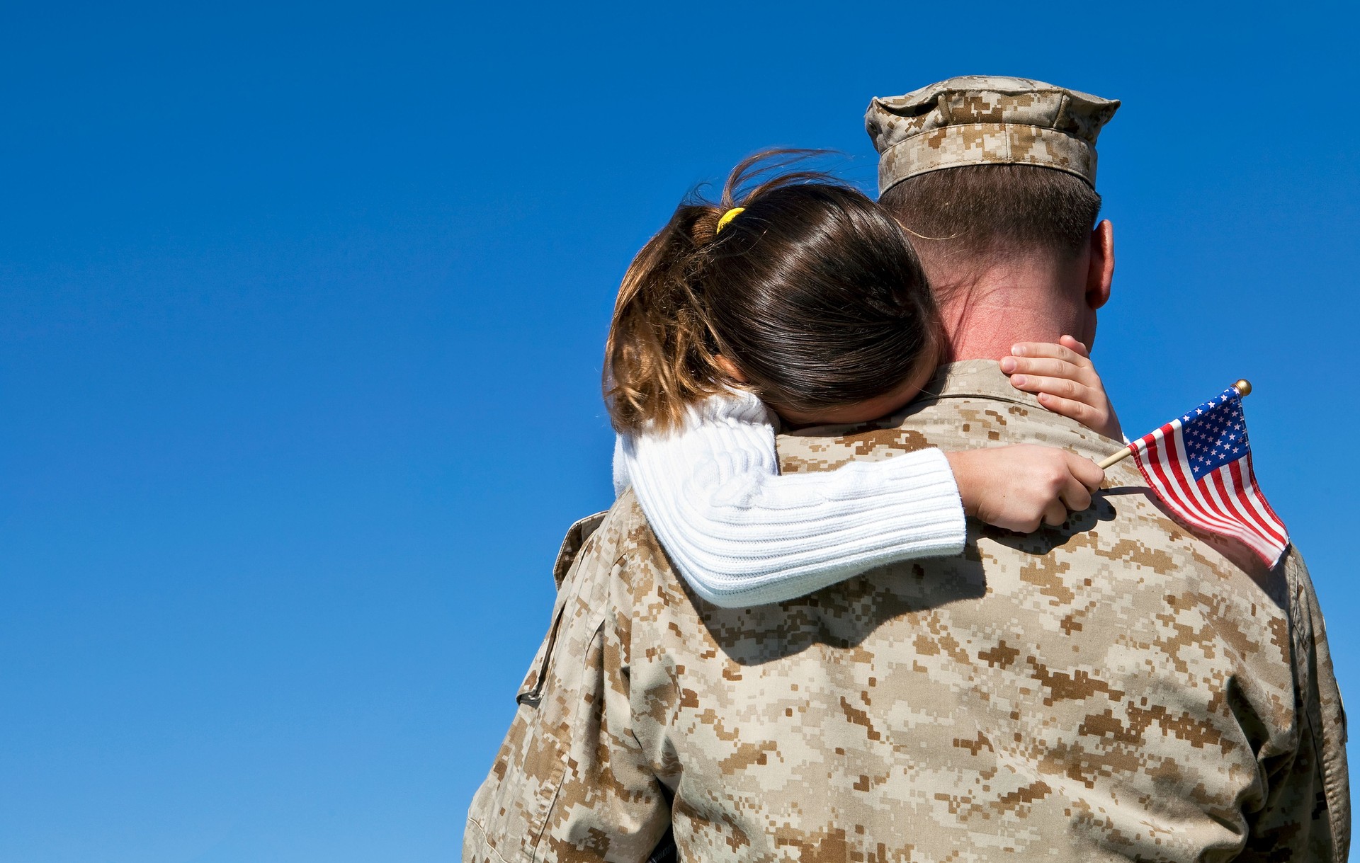 Military Man Hugs Daughter