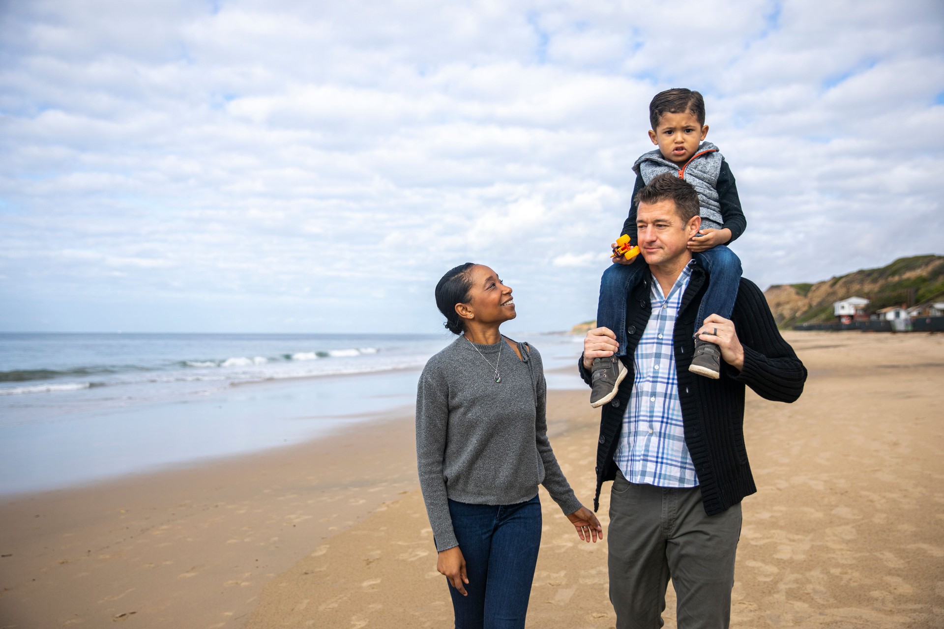 Daddy Carrying Toddler on Shoulders on Family Walk on Beach